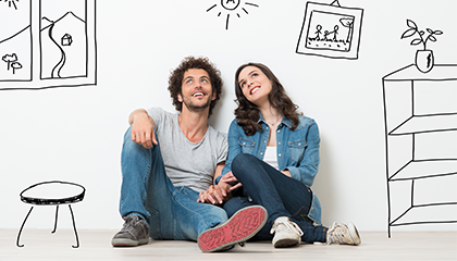 Young couple looking at ceiling while smiling