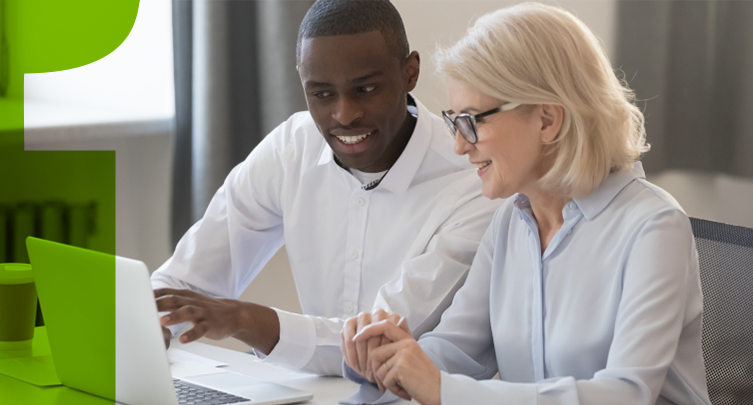 Man and woman watching computer