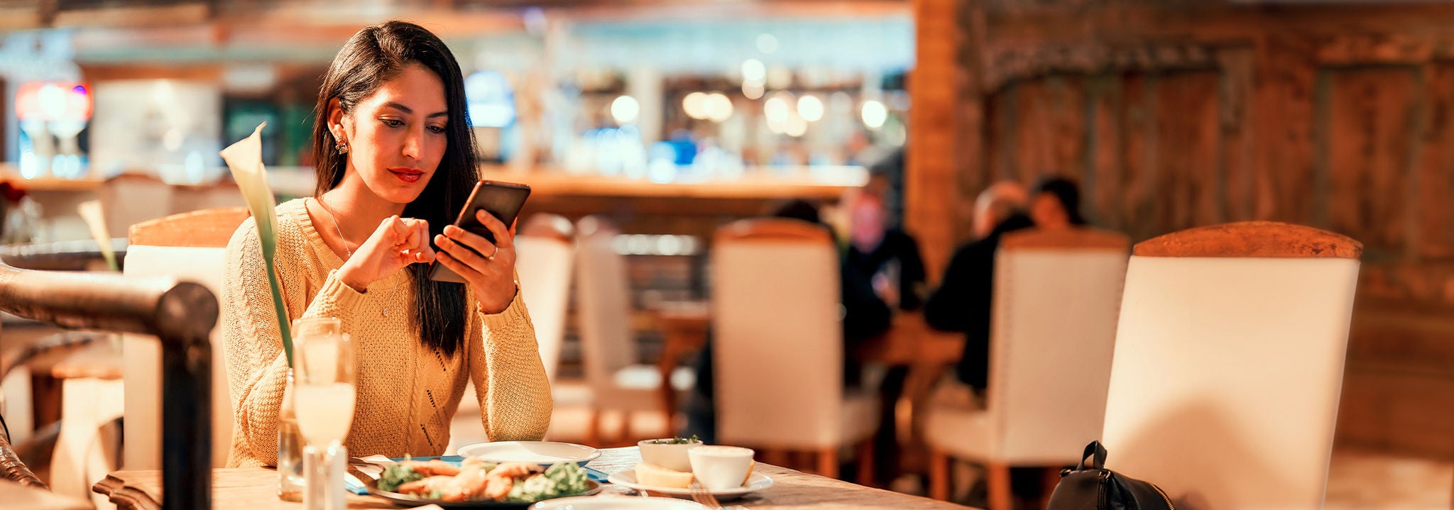 Woman having dinner in a restaurant