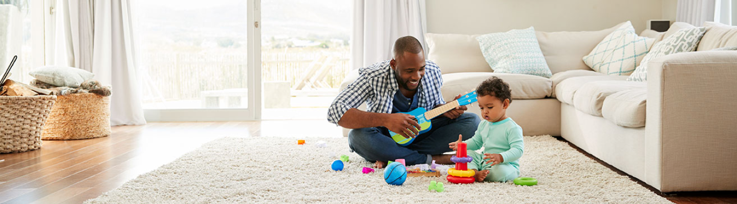 man playing with his little son