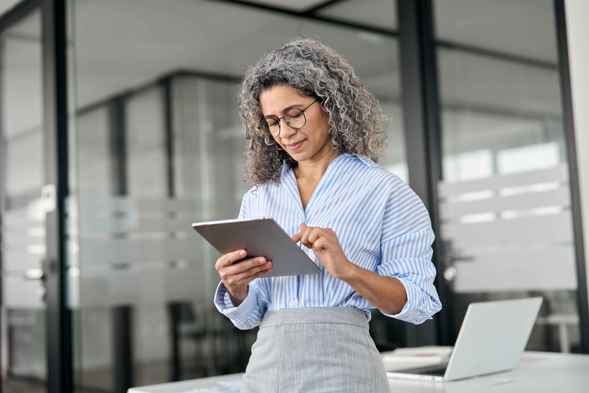 Businesswoman with an electronic device