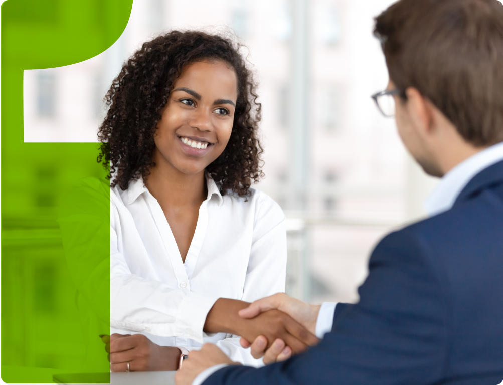 Woman shaking hands with a man