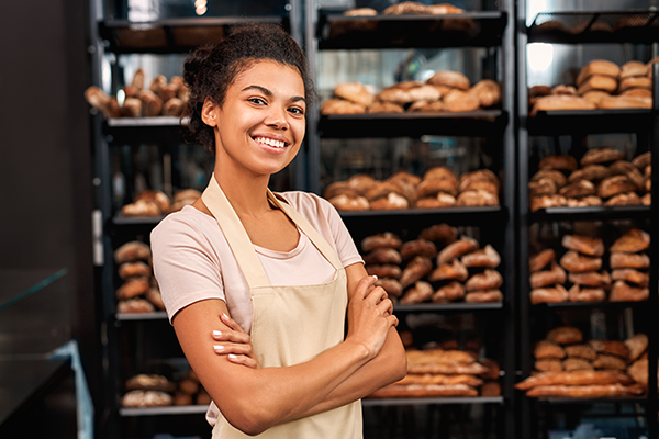 Woman smiling in a bakery