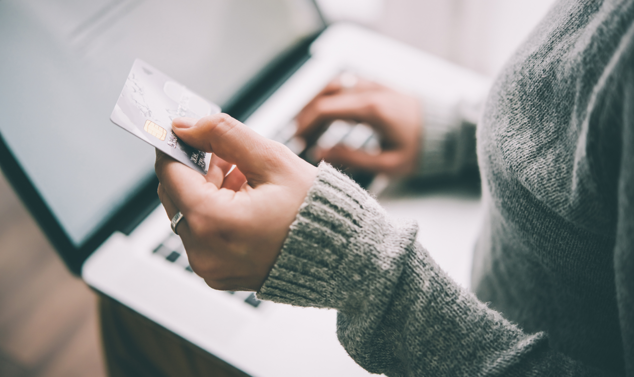 Woman adding card information to her computer.