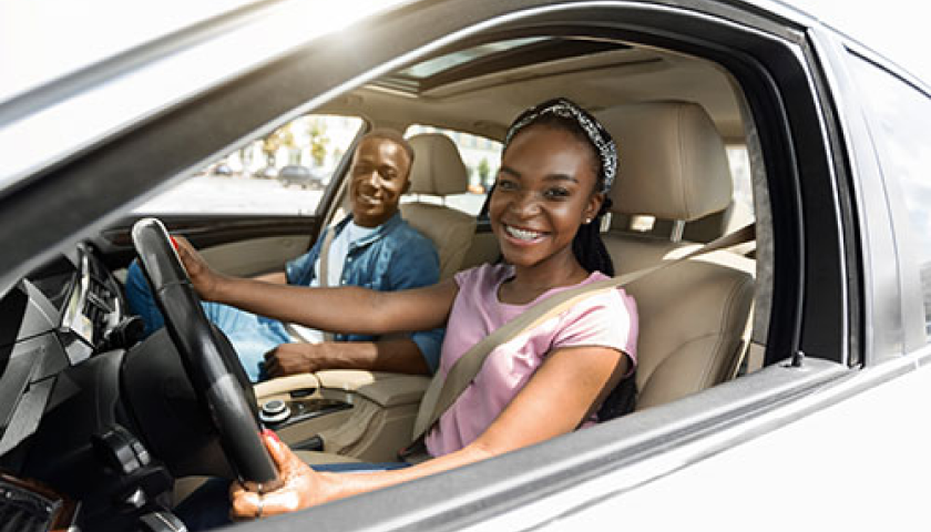 girl riding a car aside a boyfriend