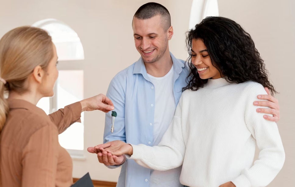 Couple reciving their new keys