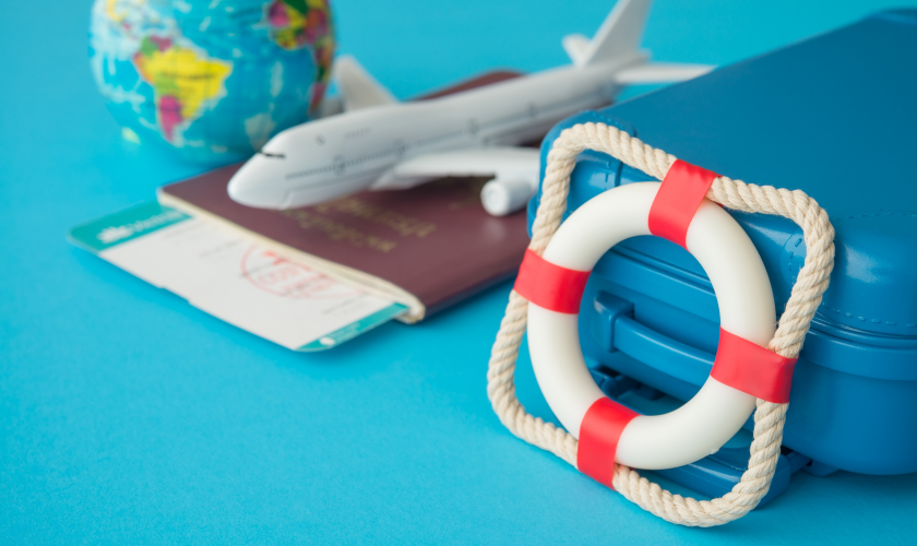 Toy life preserver next to toy airplane.