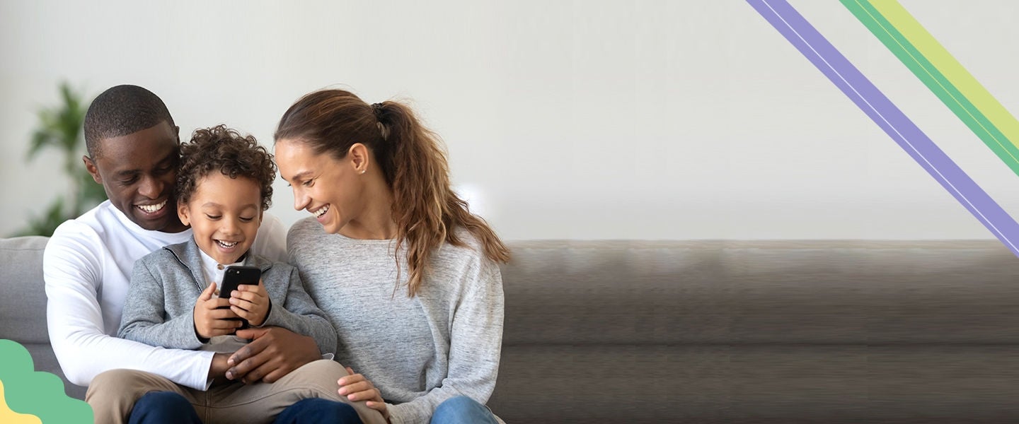 family sitting on sofa