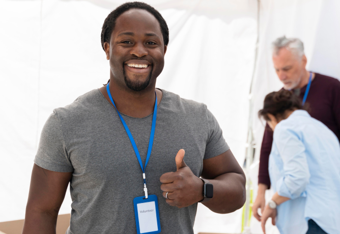 Smiling man makes okay sign