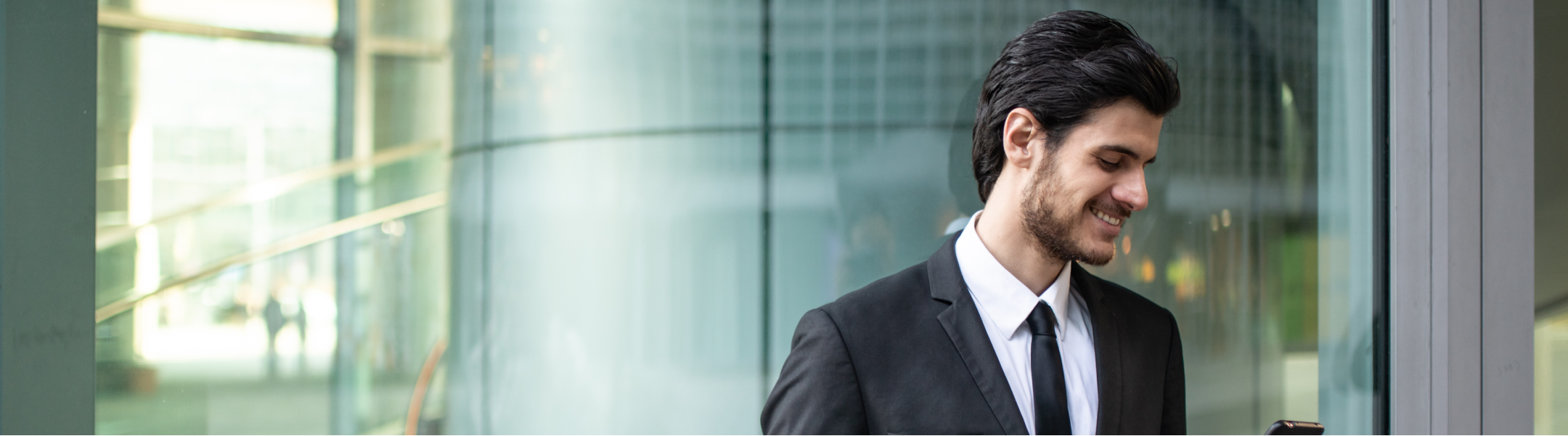 Man smilling in black suit