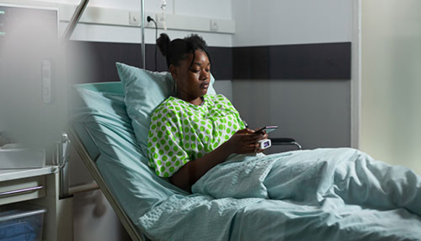 sick lady resting in a hospital bed