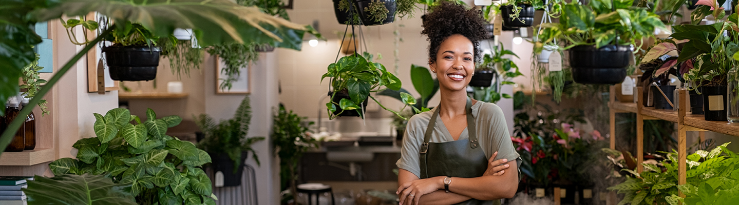 smiling woman in a plant nursery