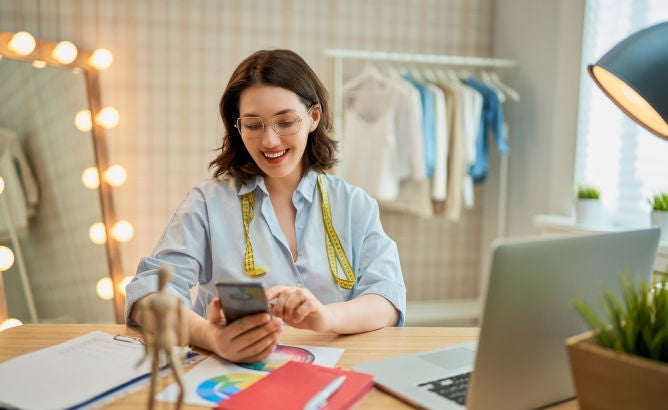 business woman with cell phone in hand