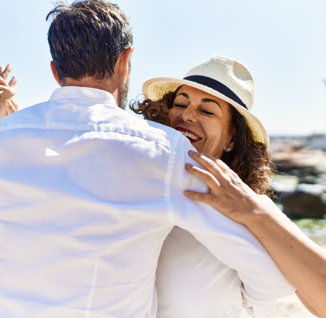 Couple dancing and smiling.