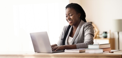 Woman using a laptop in a sofa