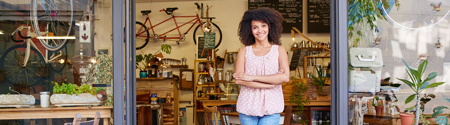 Woman in front of her business